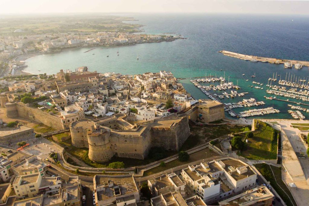 Aerial view of the Otranto Castle near the beach and the port